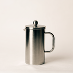 Stainless steel french press with the plunger fully depressed